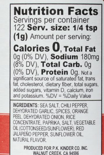 Kinder's Red Jalapeño Garlic seasoning close-up shows vibrant specks for grilled dishes.