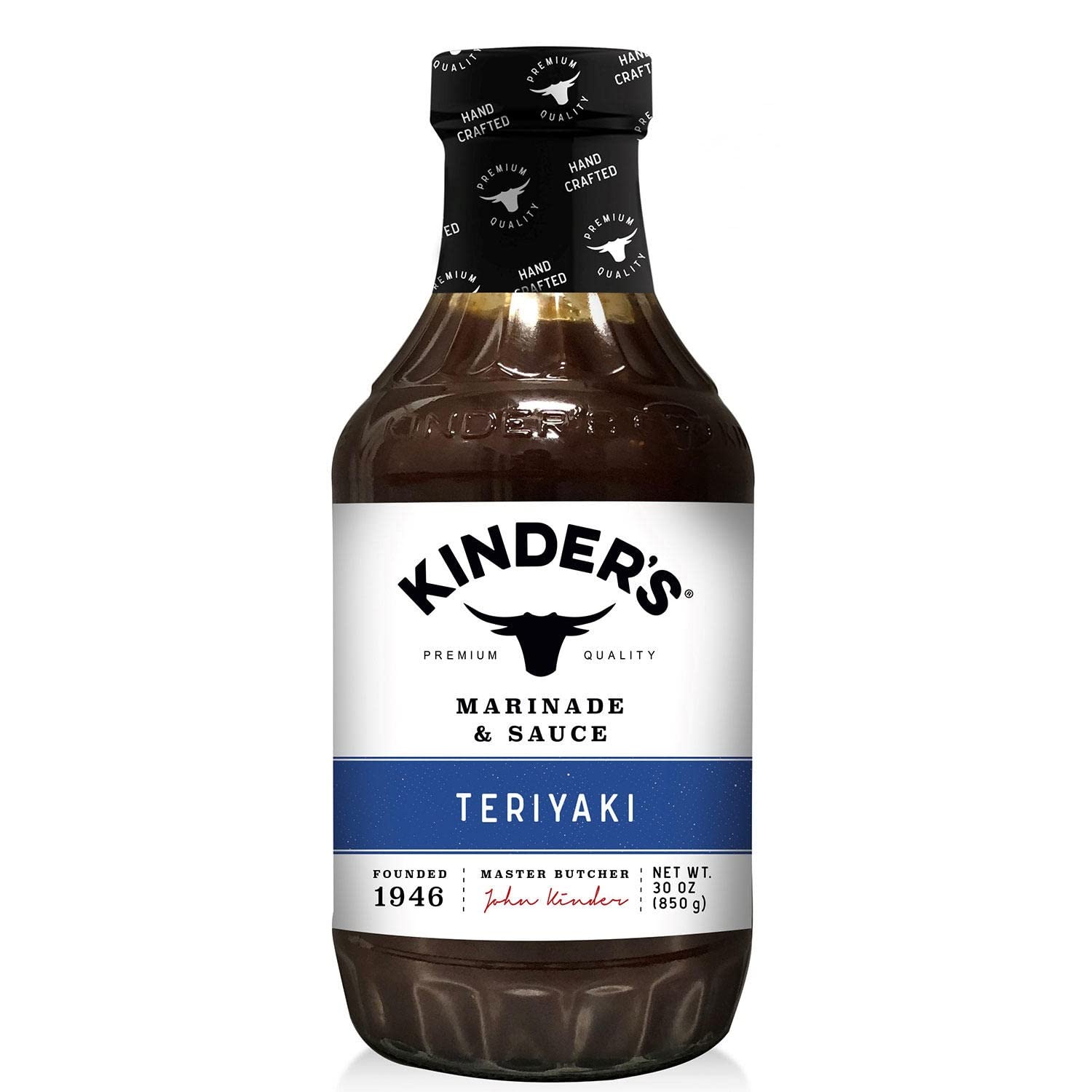 Kinder's Teriyaki bottle pouring over grilled chicken for a savory-sweet glaze.