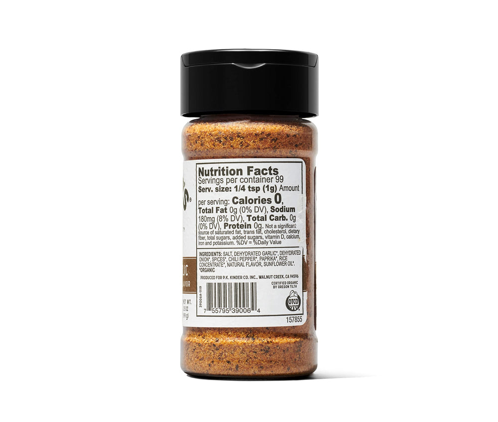 Kinder's Woodfired Garlic Rub spoon-dusting on meat for aroma