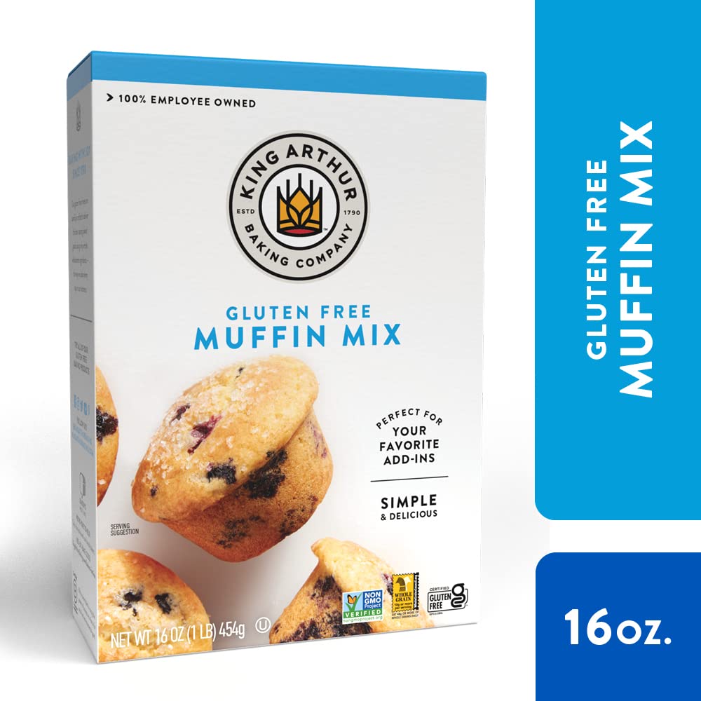 King Arthur muffin mix being measured with a cup for accurate batter
