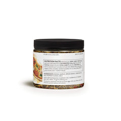 King Arthur Pizza Seasoning ingredients close-up showing herbs and red pepper flakes for bold flavor.
