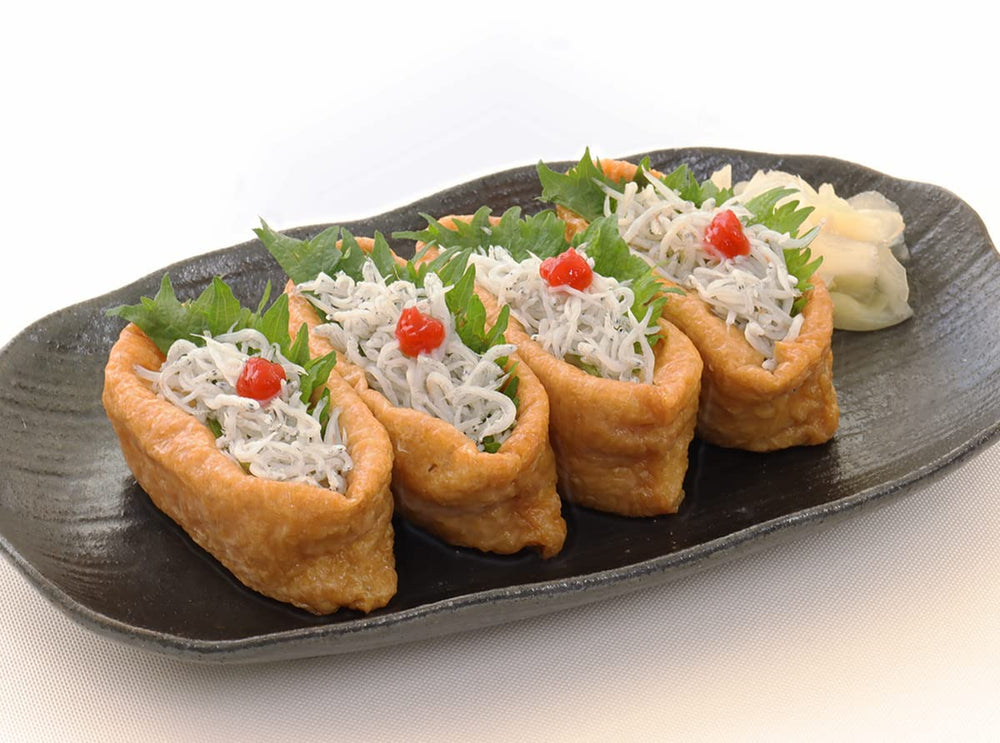 KINJIRUSHI BRAND Umeboshi paste on sushi platter for tangy accent.