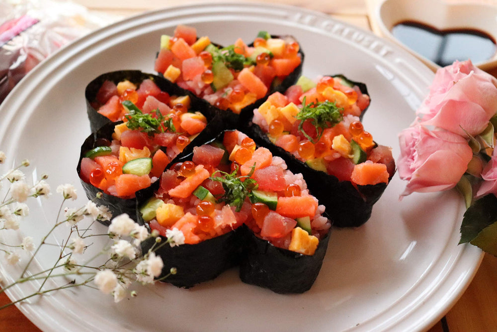 Kinjirushi Umeboshi paste on nigiri or sushi plate, enhancing umami in small amounts.