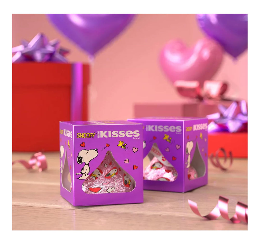 Kisses friends edition packaging artwork features Peanuts characters for nostalgic gifting appeal.