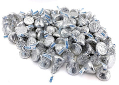 KISSES displayed at a party table, ideal for celebrations.