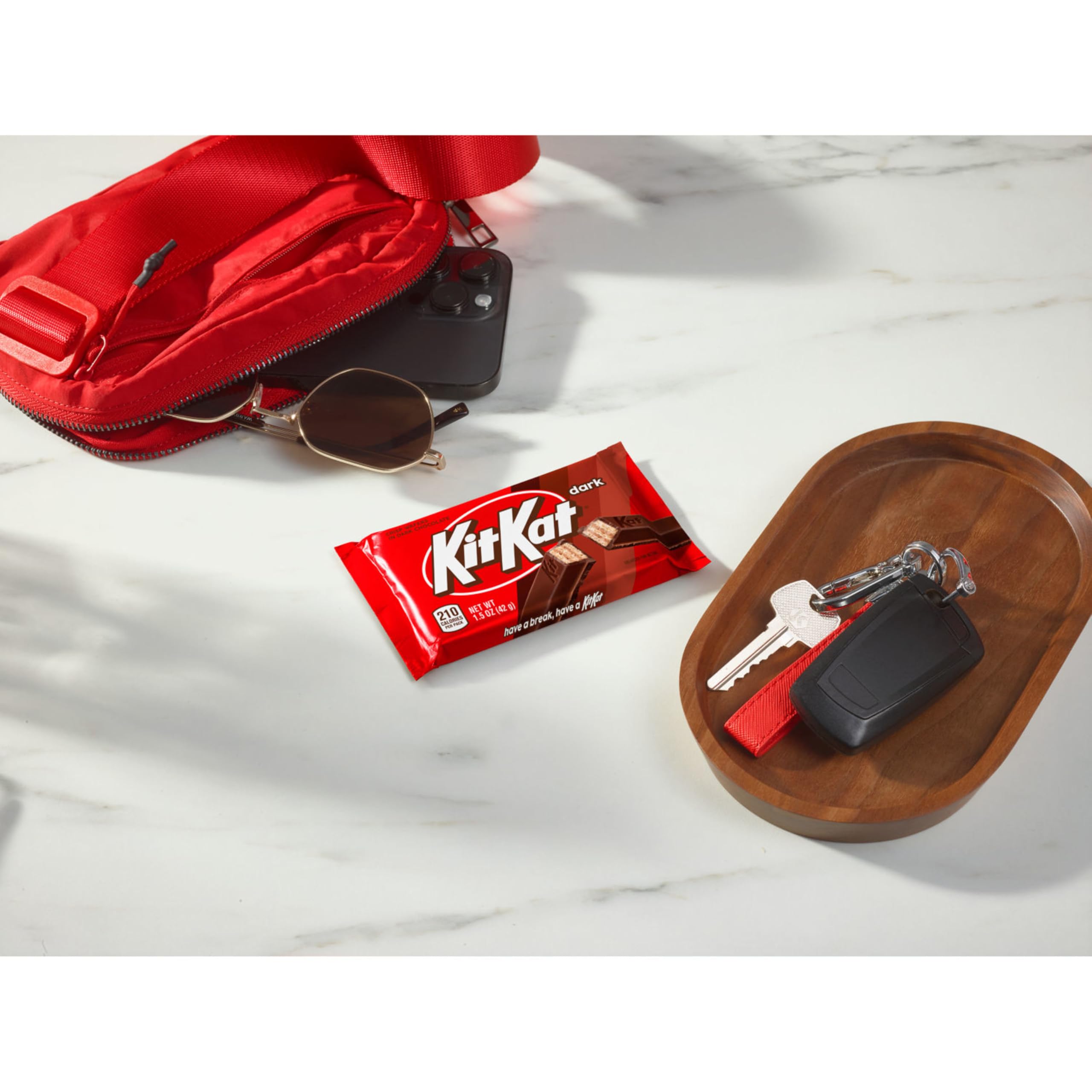 Kit Kat in office candy bowls satisfies quick cravings.