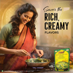 Kitchens of India Palak Paneer cottage cheese closeup, soft cubes in vibrant spinach sauce.