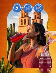 Pouring the Hibiscus Berries mix into water for a refreshing drink