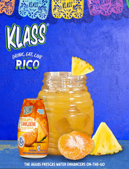 Klass Aguas Frescas pineapple-tangerine poured into a glass.