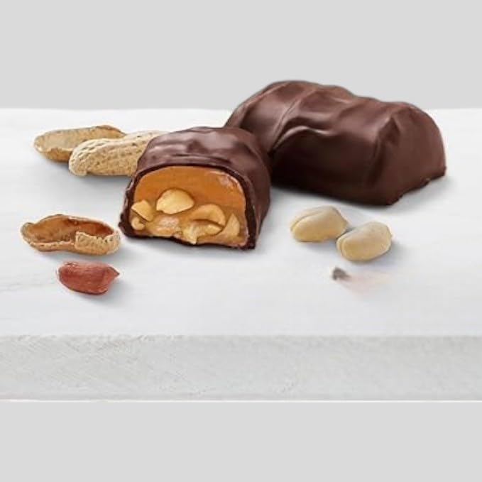 KLUB BULK close-up of chewy nougat with peanuts and caramel, creamy bite with no sugar.