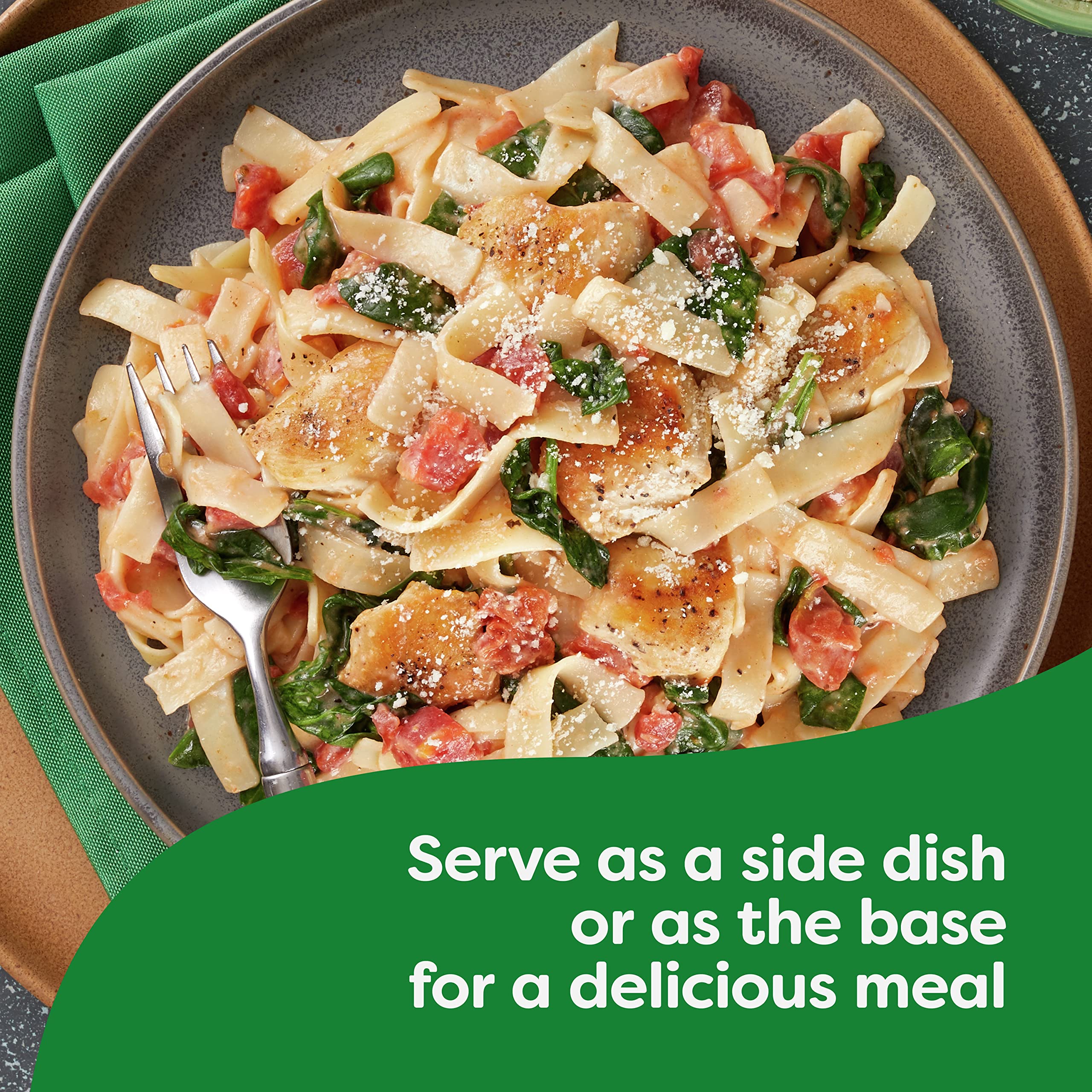 Creamy Knorr Alfredo sauce with herbs on pasta