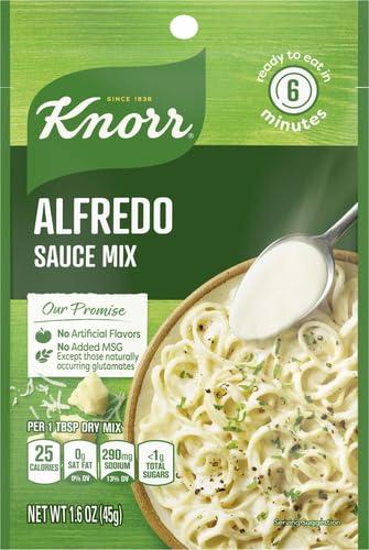 Parmesan sprinkled on pasta with Knorr Alfredo Sauce Mix ready to serve.