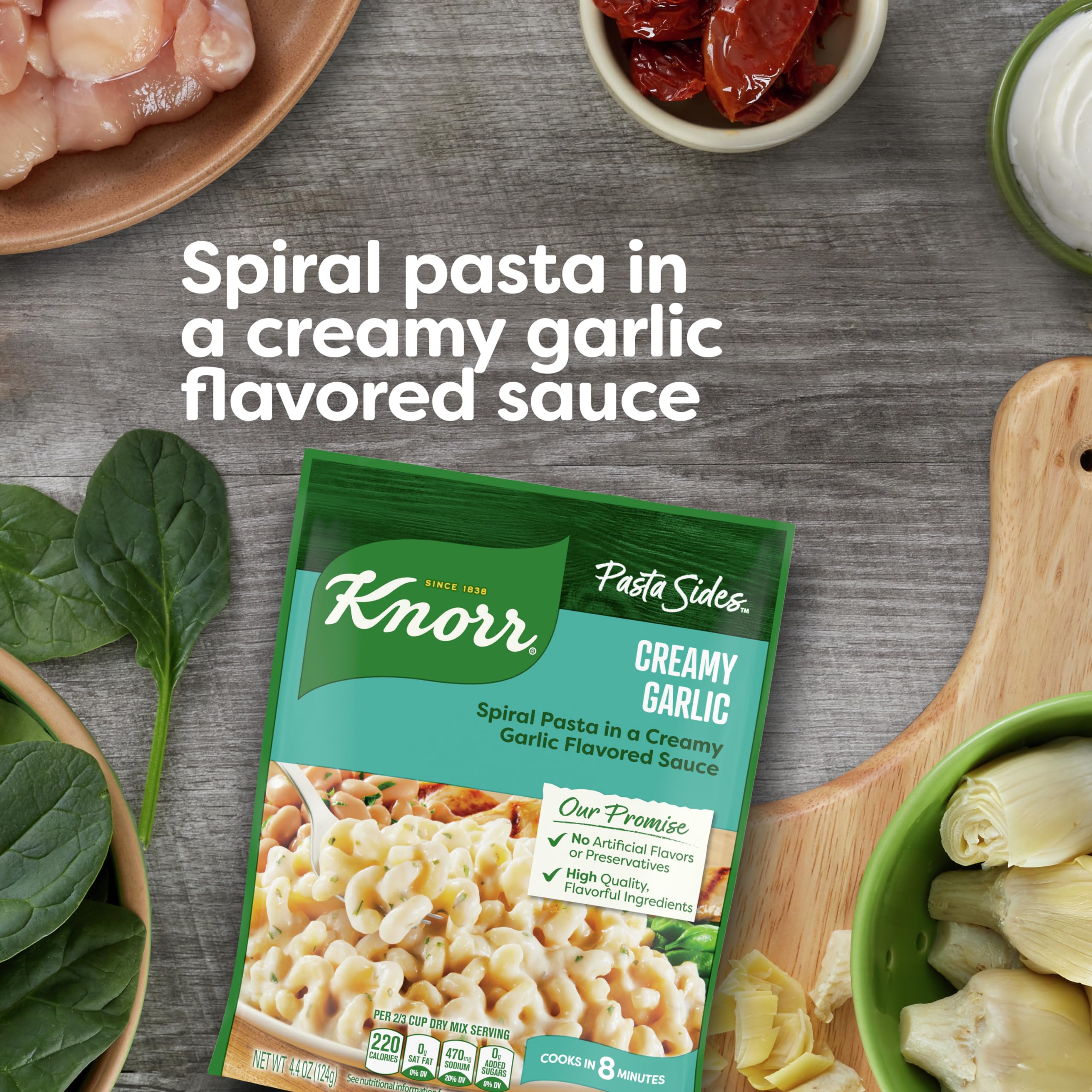 Knorr Creamy Garlic ingredients close-up with garlic, butter, and Romano cheese.