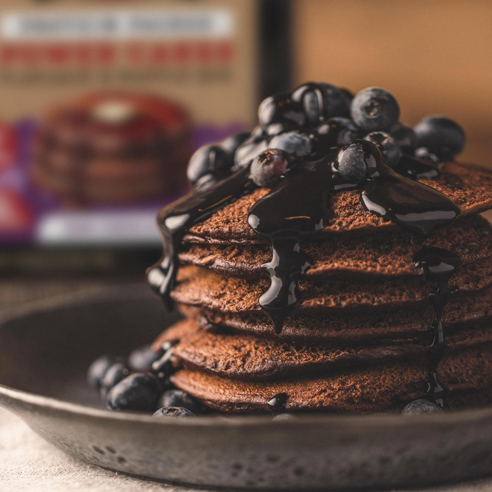 Pancakes with fruit and yogurt using Kodiak Cakes Dark Chocolate mix.