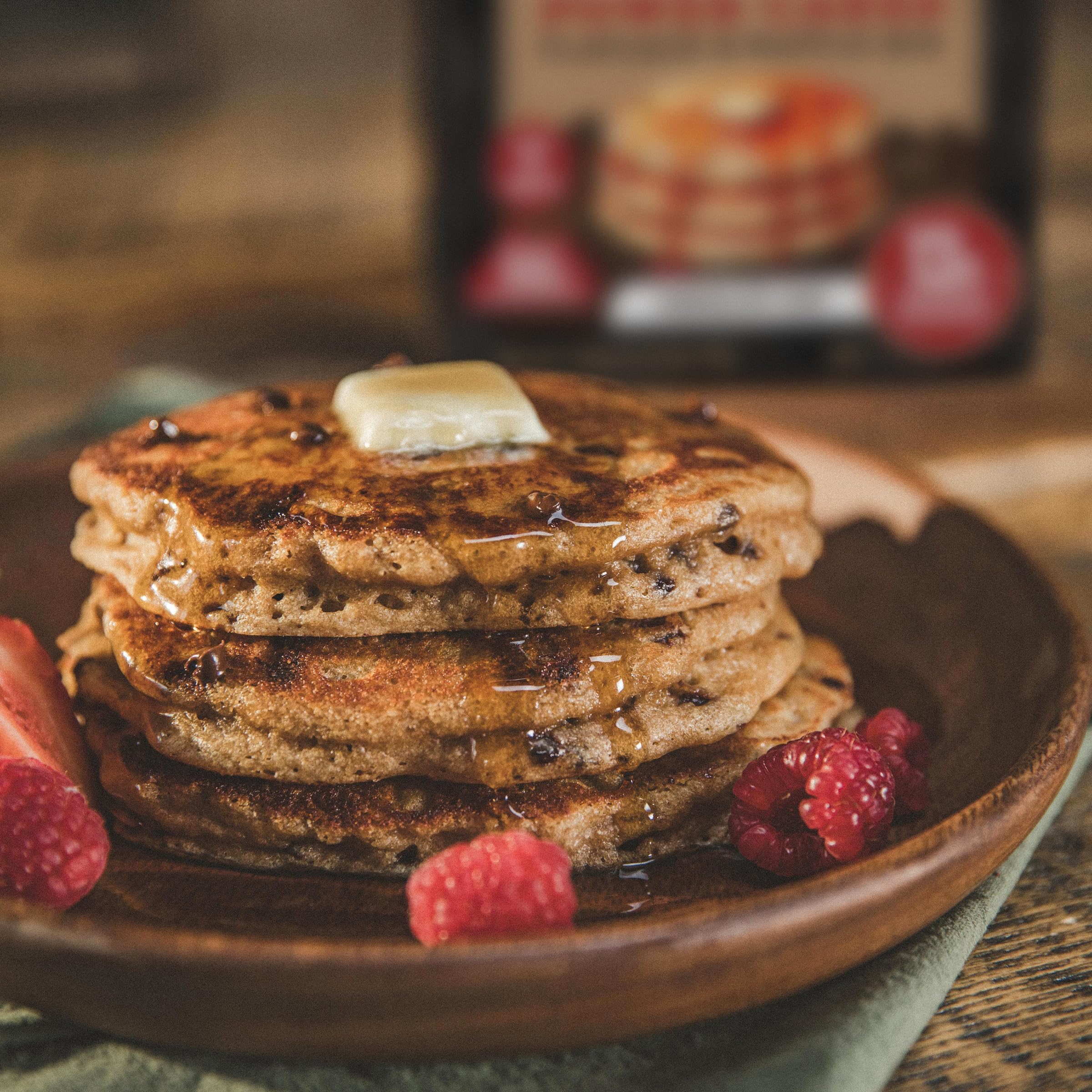 Family breakfast scene featuring Kodiak Cakes chocolate chip pancakes.