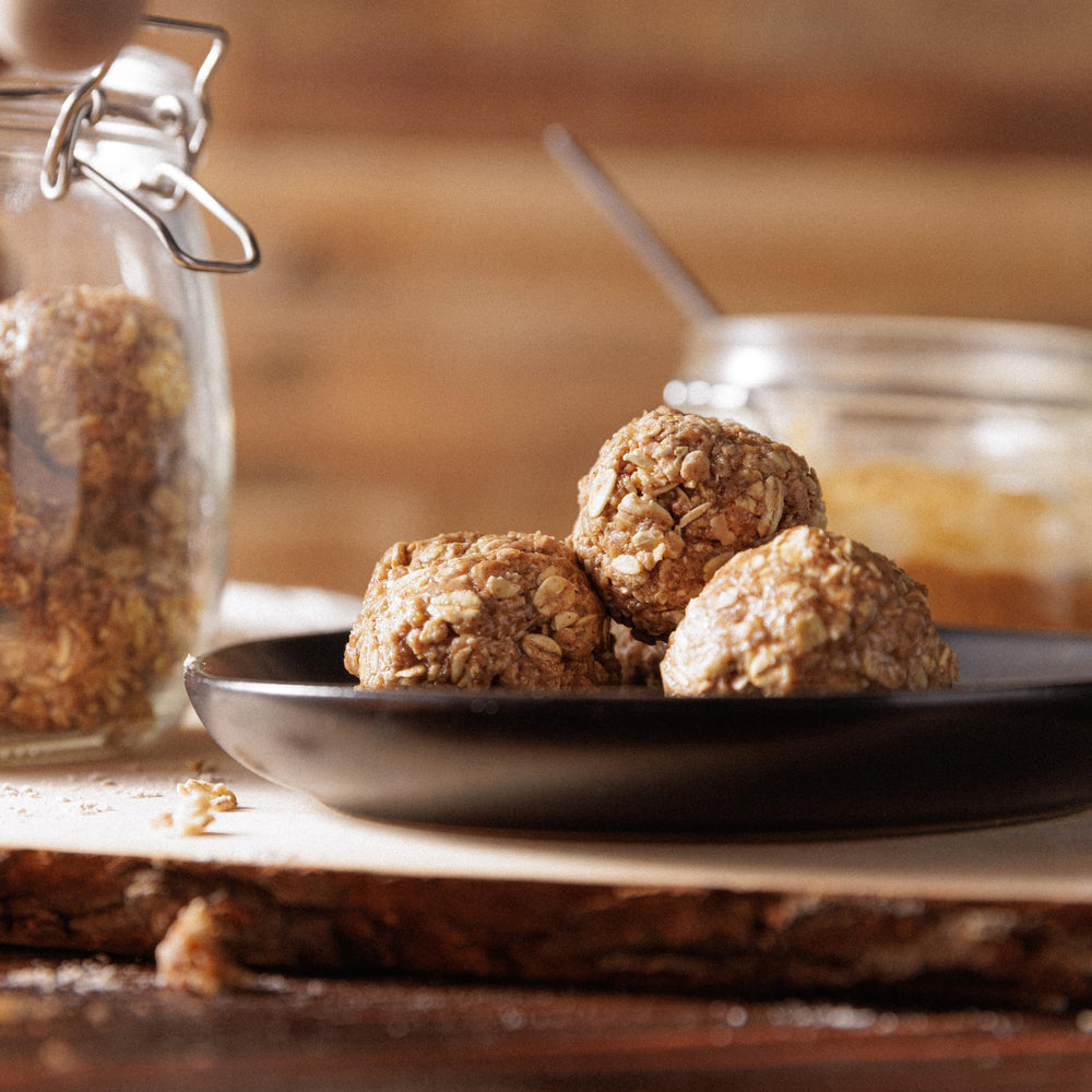 Kodiak Cakes snack-ready balls in hand illustrate portable protein boost.