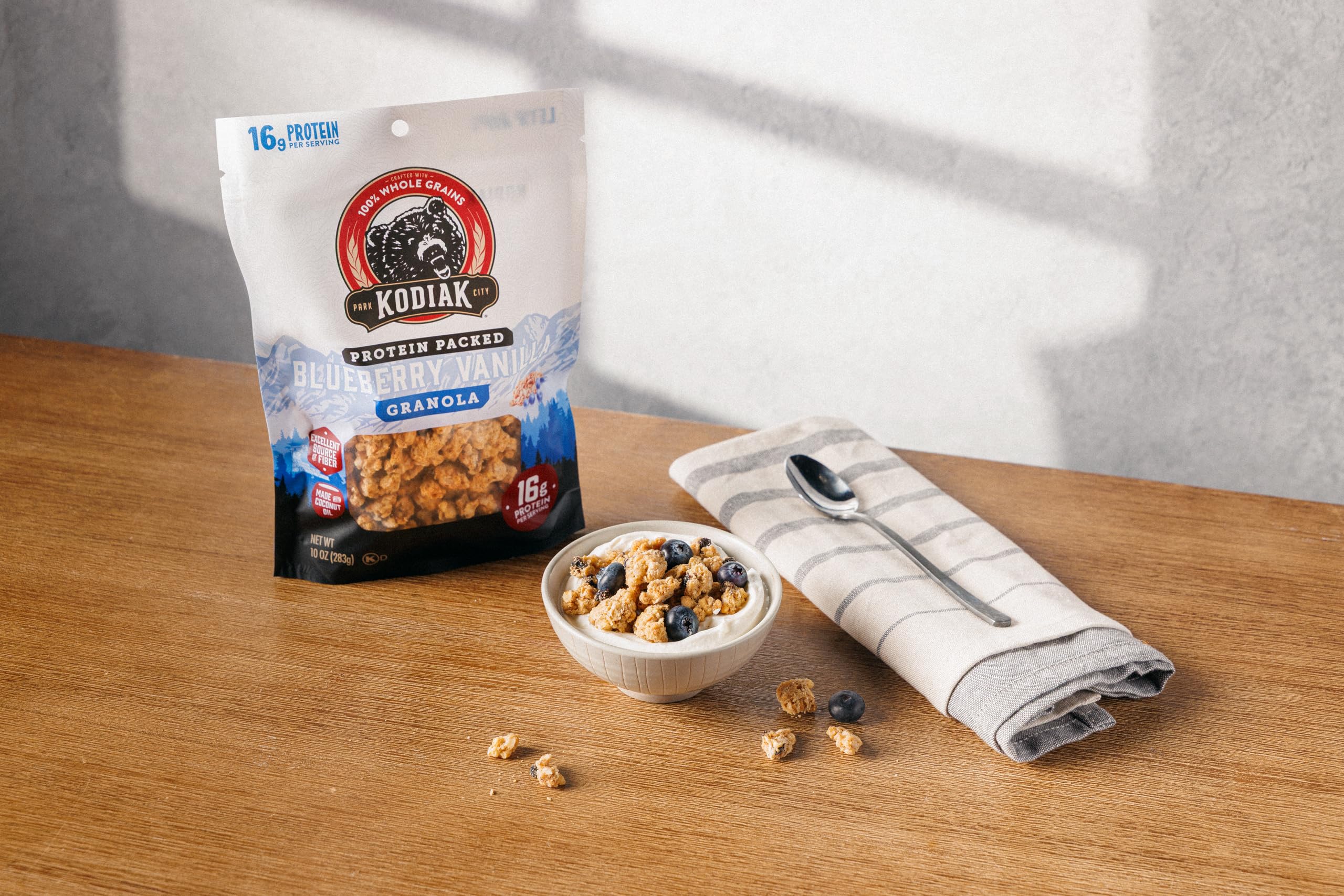 Kodiak Cakes granola topping with yogurt as a smart breakfast.