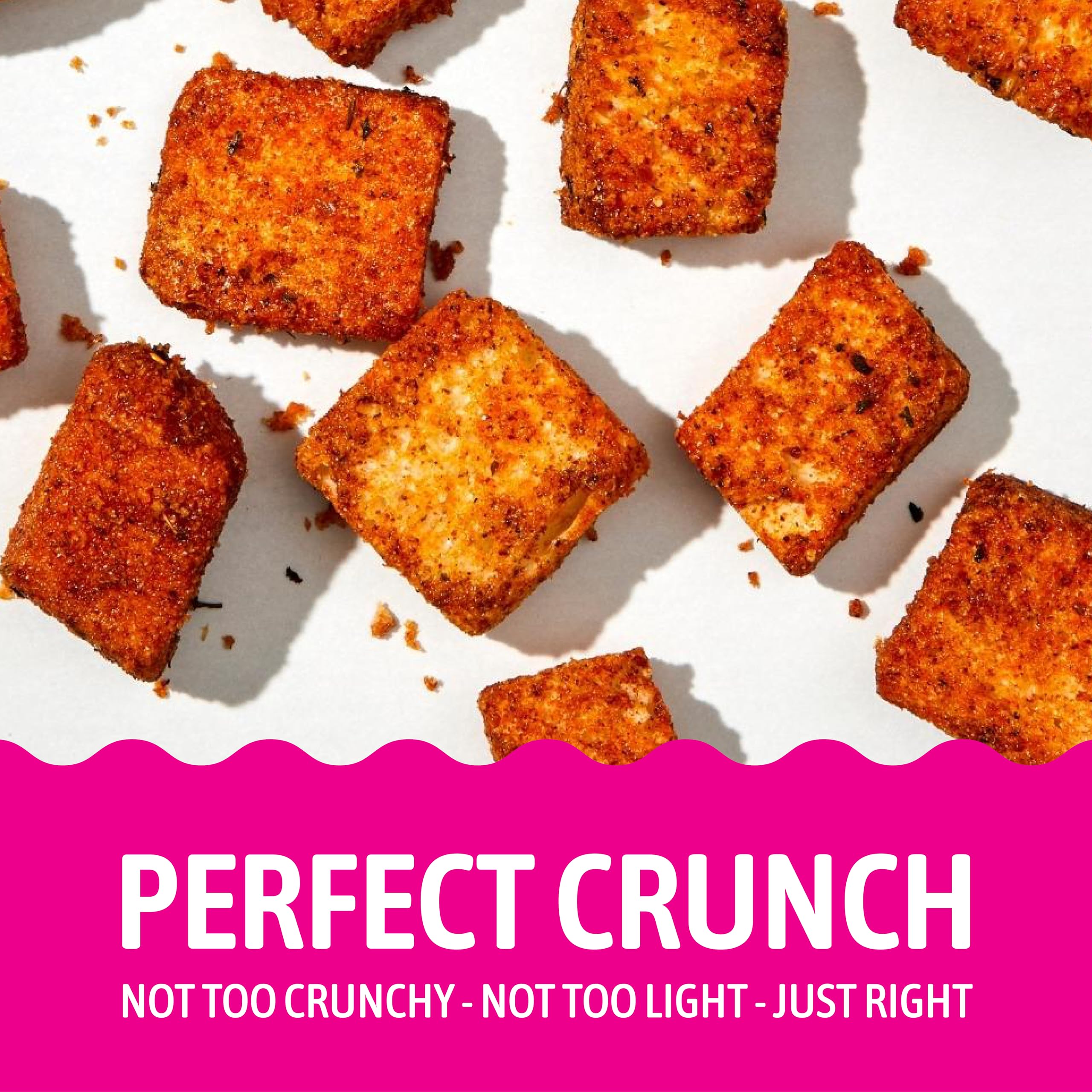 Kooshy Croutons Poco Picante topping a warm soup bowl for added crunch.