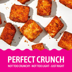 Kooshy Croutons Poco Picante topping a warm soup bowl for added crunch.