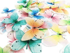 KOOTIPS pastel toppers on cupcakes finalize a refined celebration look.