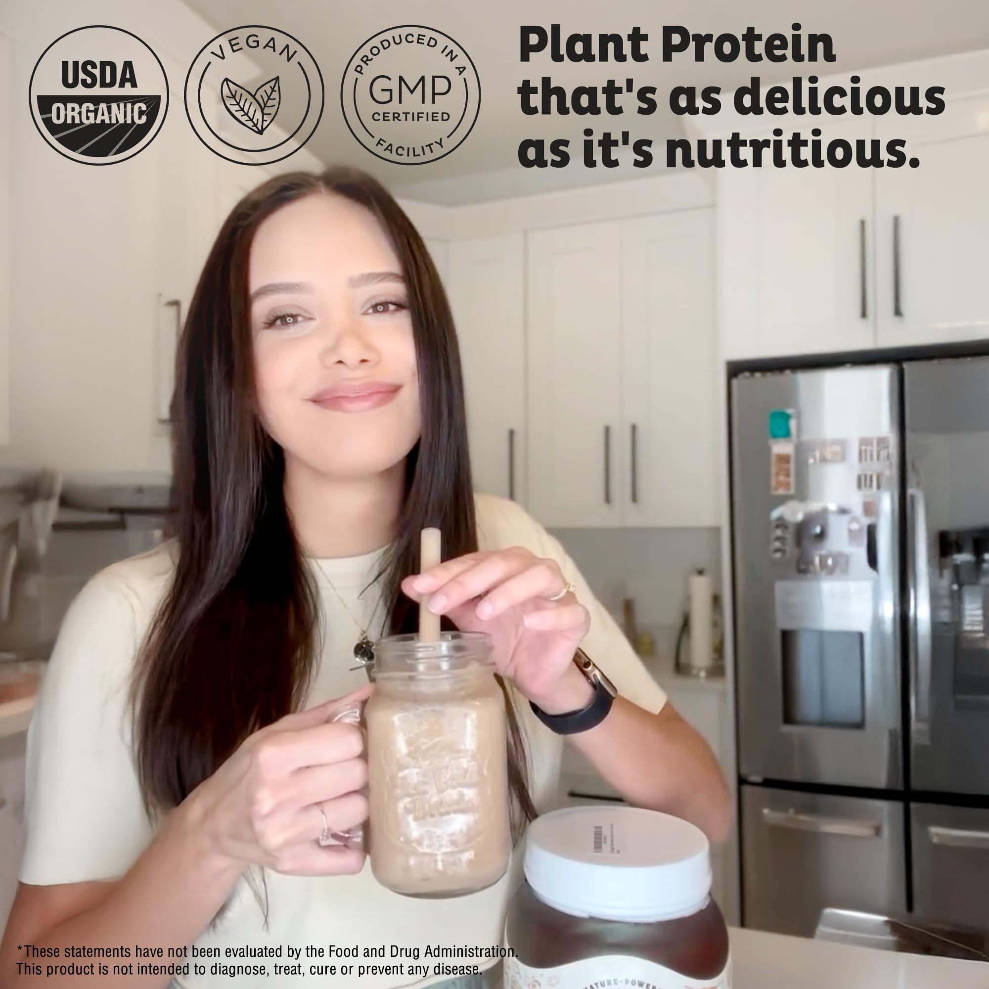 KOS protein powder being mixed in a glass for a quick shake.