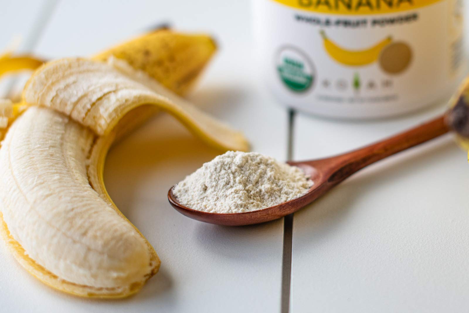 KOYAH Banana Powder close-up reveals a light yellow, fine texture.