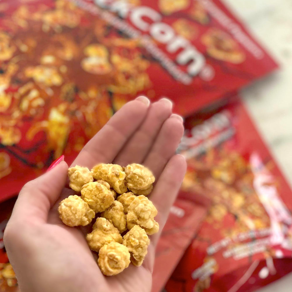 KrackCorn caramel popcorn on table ready for sharing at parties.