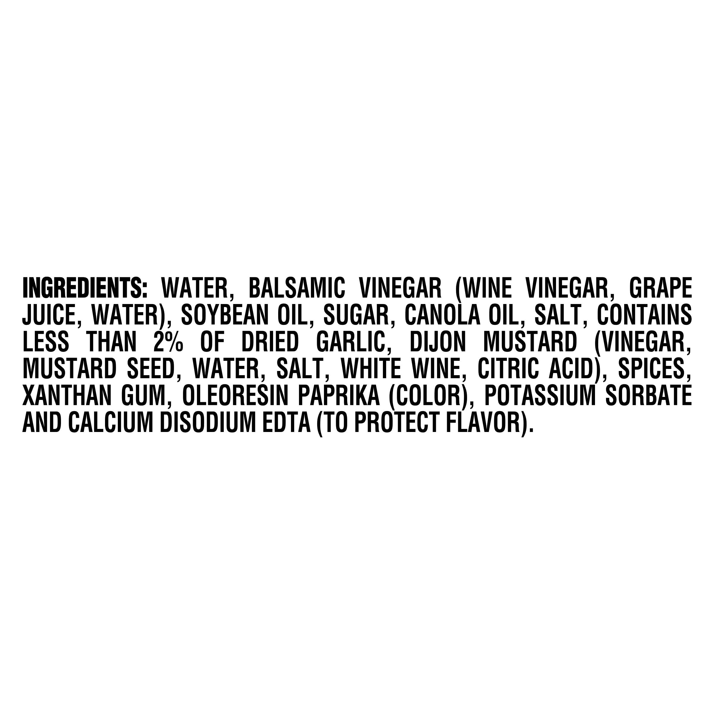 Kraft Balsamic Vinaigrette being poured over a fresh salad