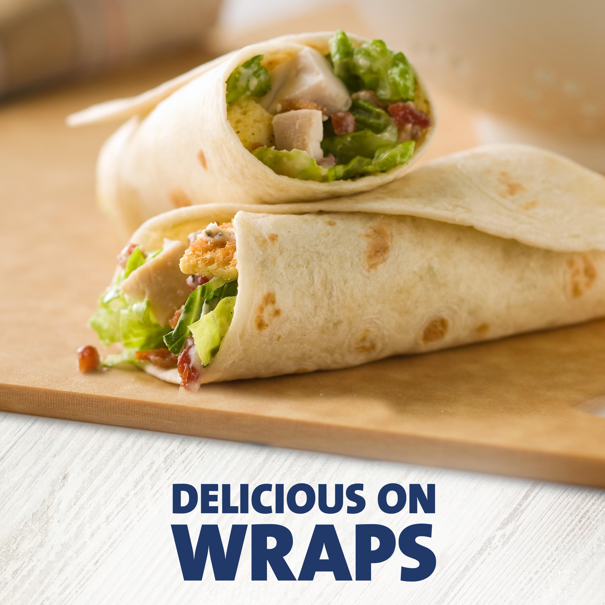 Kraft Caesar dressing on crisp romaine, perfect for easy salads.