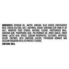 Pouring Kraft Chunky Blue Cheese Dressing on Buffalo wings