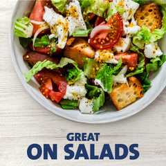 Kraft Zesty Italian Fat Free dressing tossed into a bowl.