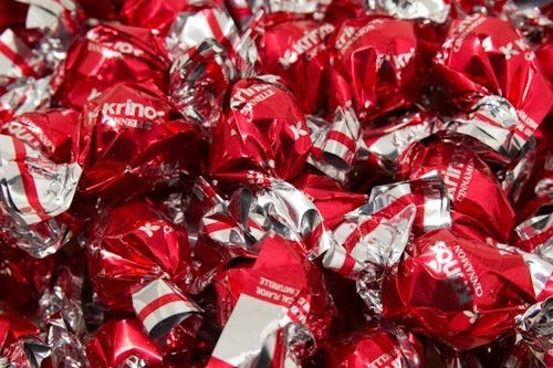 Krinos Ouzo Candy party favors showcased for celebrations and guests.