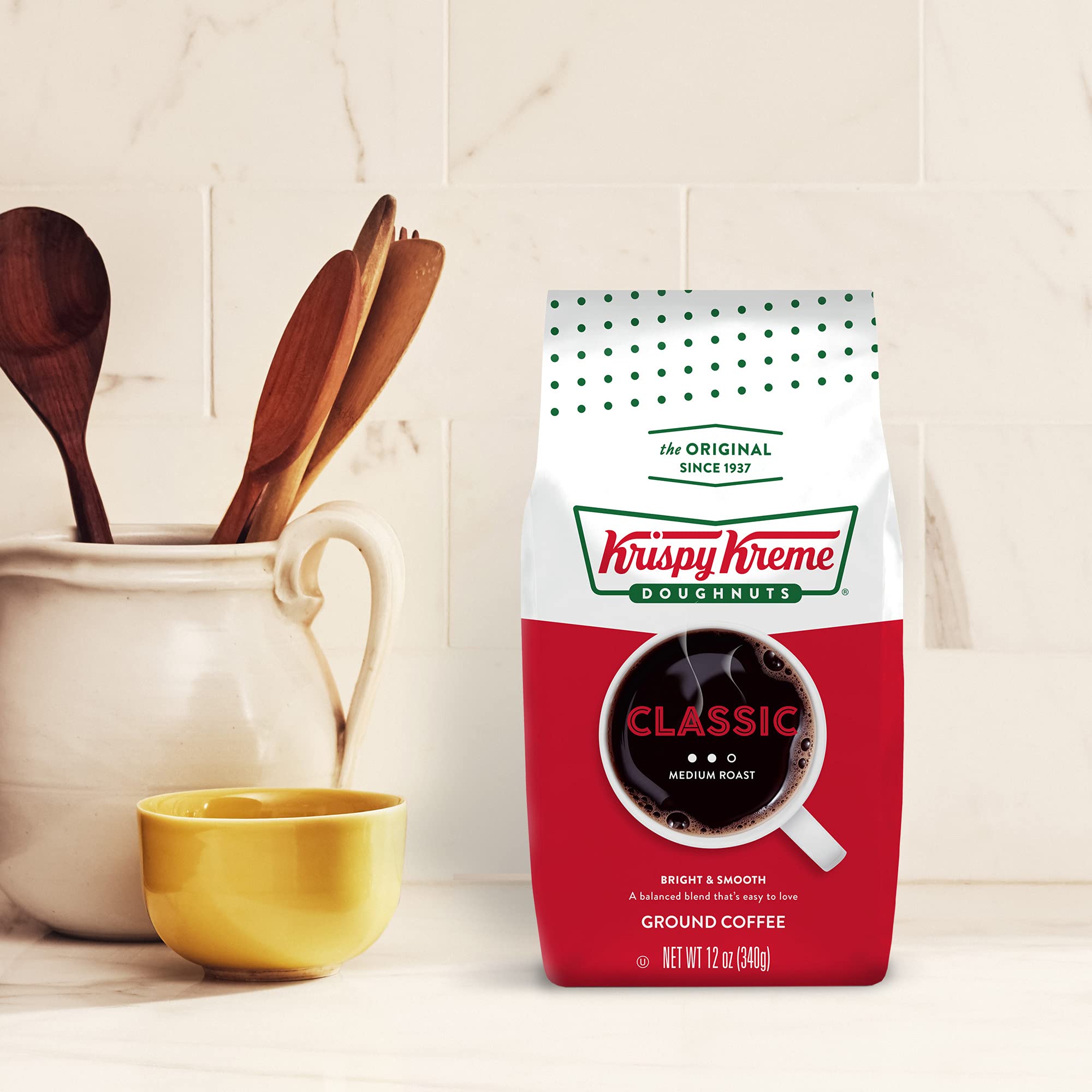 Krispy Kreme Classic coffee steaming in a mug beside a doughnut