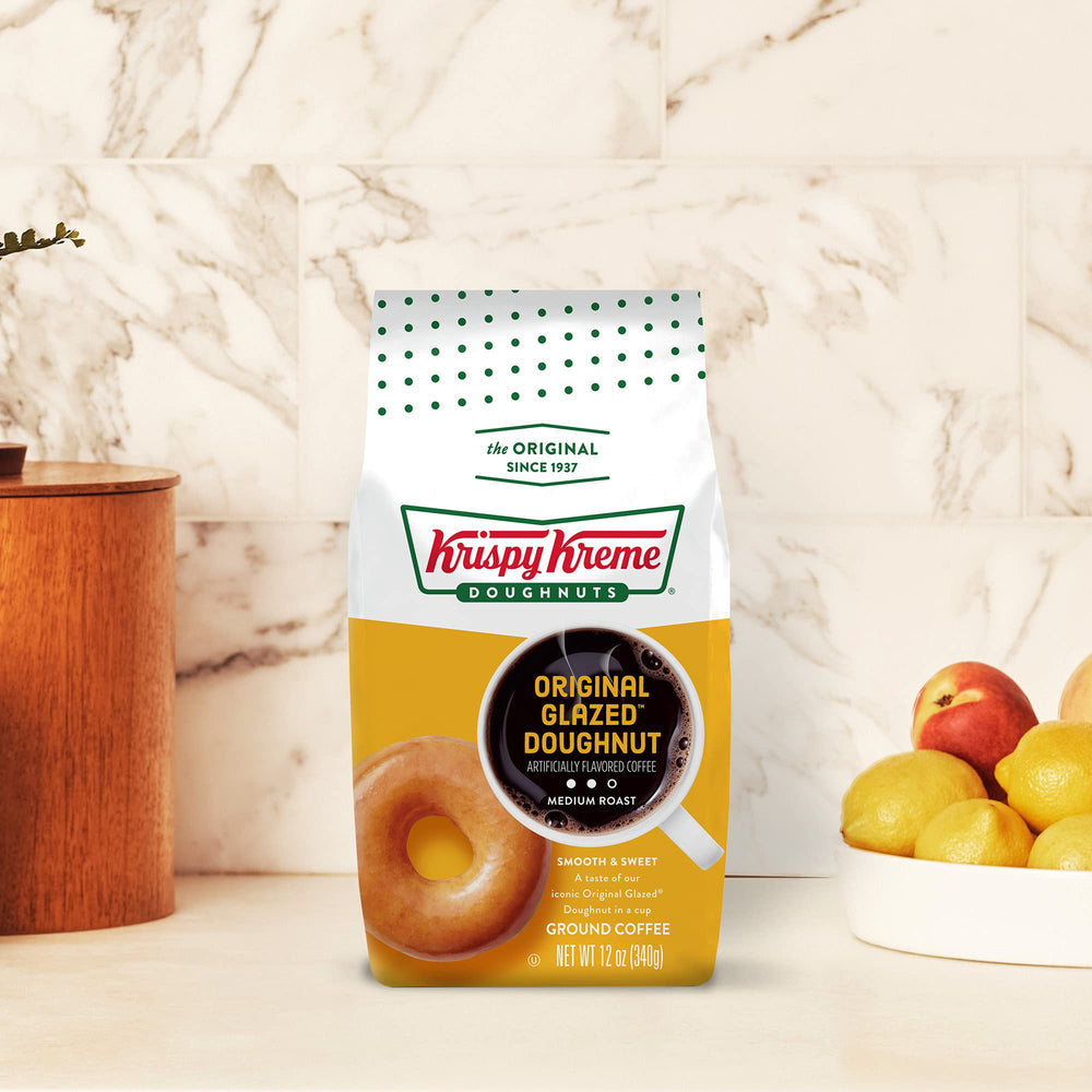 Krispy Kreme cup beside a donut, perfect cozy morning moment
