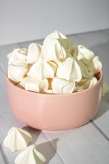 Krunchy Melts original vanilla meringue cookie in bag, perfect for on-the-go snacking.