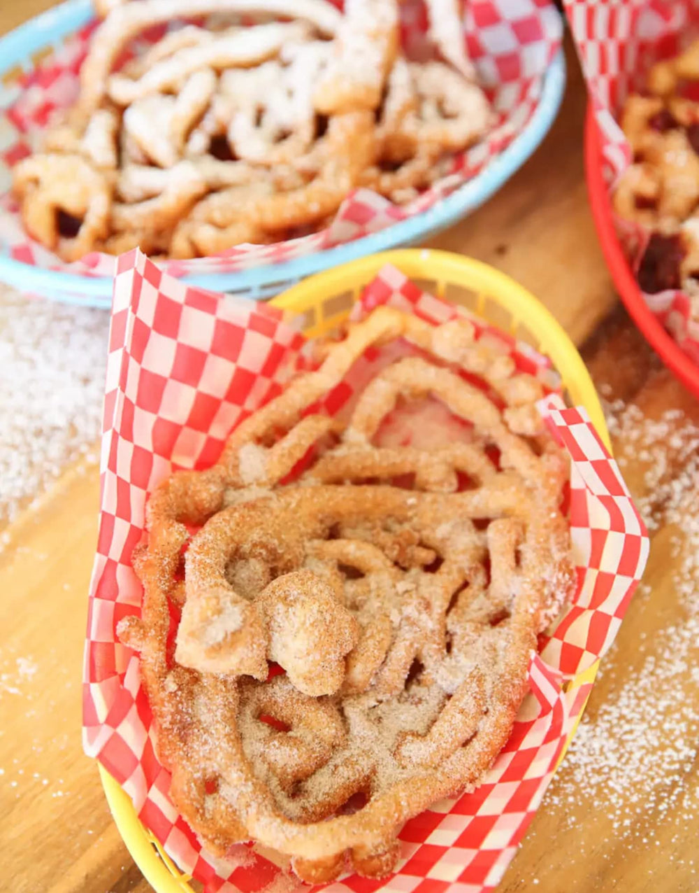 Krusteaz funnel cake mix served with toppings like fruit.