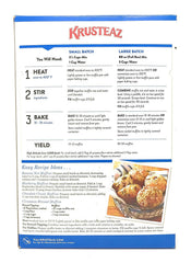 Freshly baked Krusteaz Professional Muffin Mix muffins on a plate with light crumb