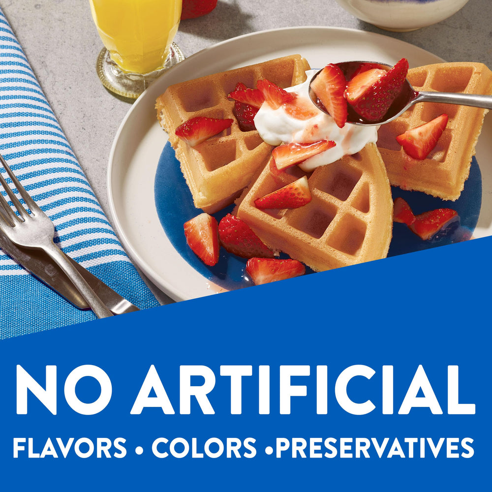 Toppings ideas for Krusteaz waffles: berries and syrup on top.