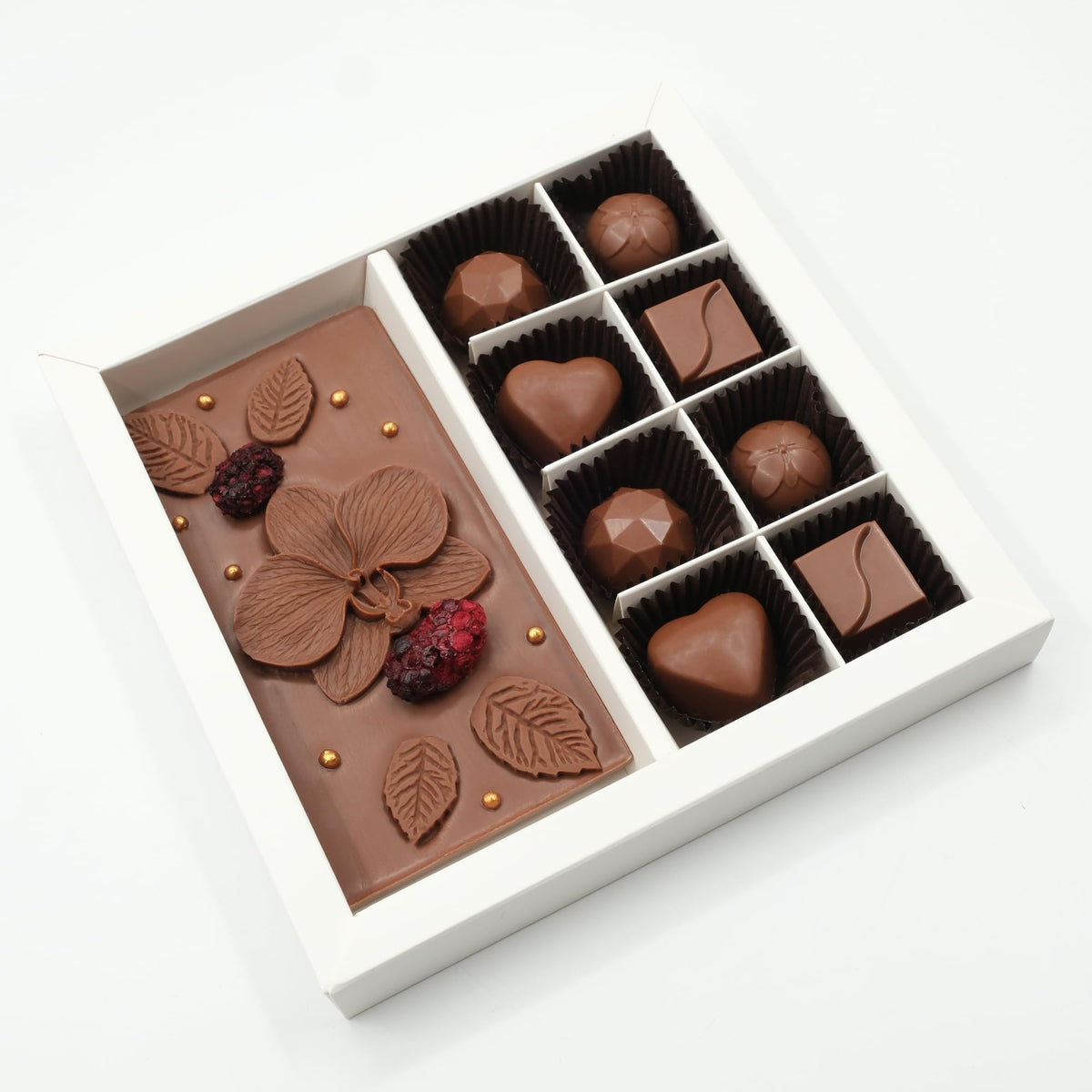 Ksana Choco Orchid Tablet with artisanal floral decor and creamy milk chocolate.