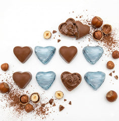 Ksana heart-shaped chocolates with bear accents, perfect for birthdays and anniversaries.