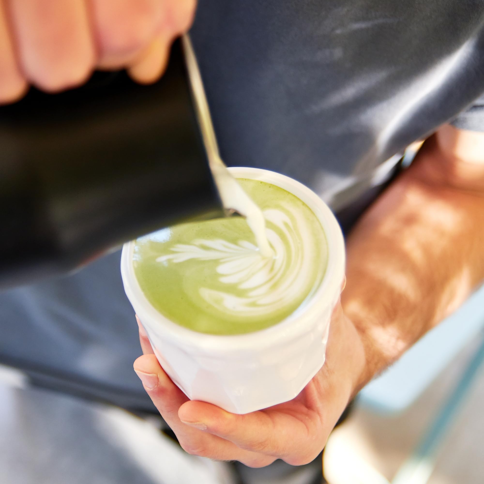 Kuli Kuli Mo Matcha Moringa Latte setup with mug and spoon for easy brewing
