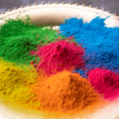 Kulture Khazana blue Holi color powder creates vivid color clouds for photos.