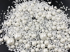 Kuting white sugar pearl sprinkles on brownies for a pearlized touch