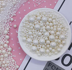 Kuting white pearl candy sprinkles on a cake topper add sparkle and texture