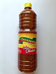 La Botanera Clasica hot sauce bottle, red, adds bold flavor to grilled meats and tacos.
