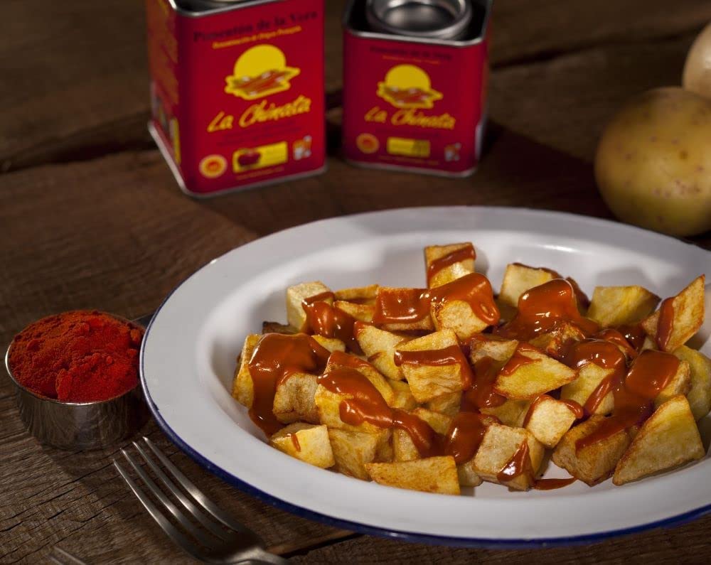 La Chinata Sweet Smoked Paprika Powder paella dish shows vibrant color.