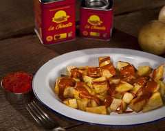 La Chinata Sweet Smoked Paprika Powder paella dish shows vibrant color.