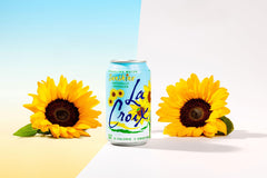 La Croix Sunshine glass pour for mocktails and poolside refreshment.