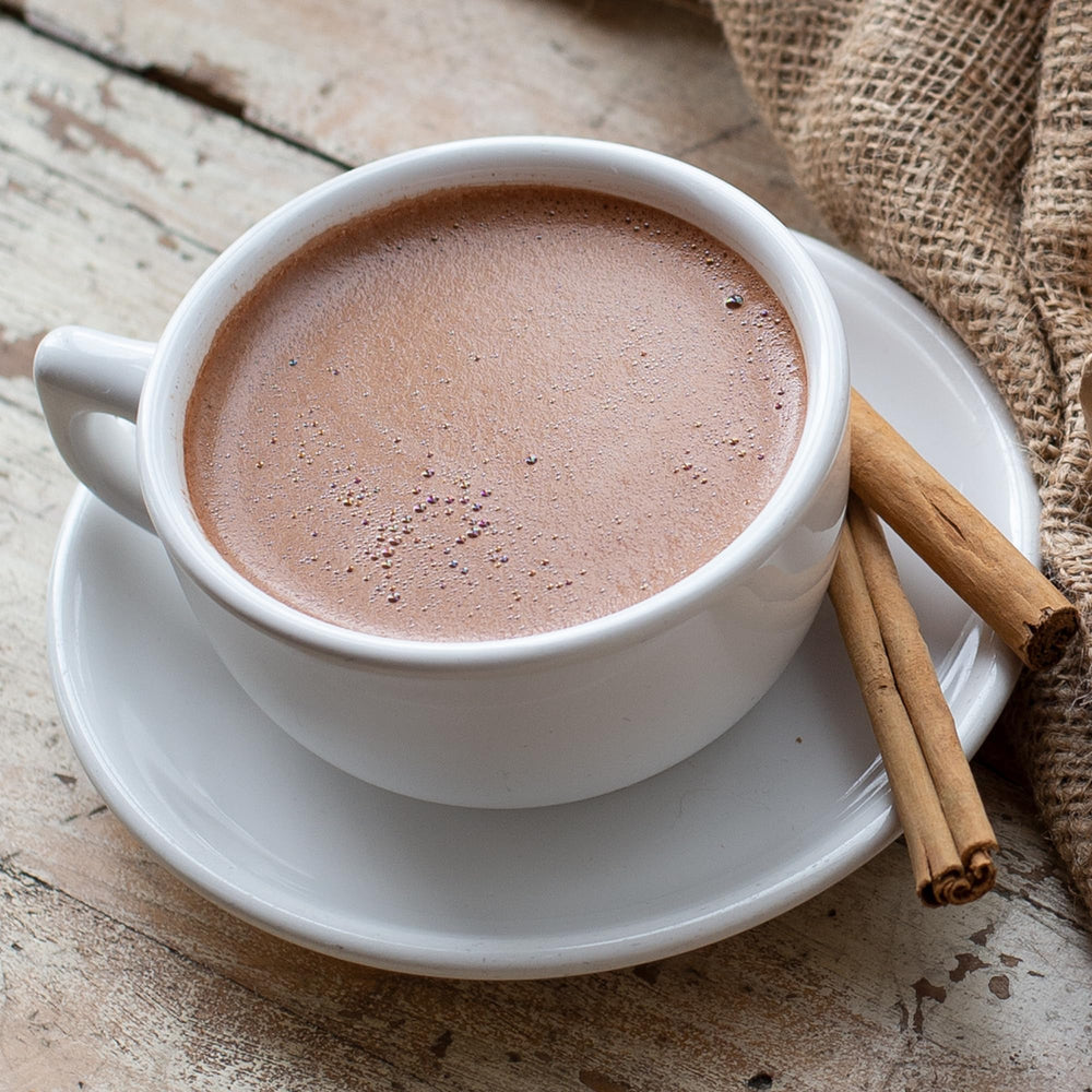 La Monarca Bakery creamy cocoa foam close-up for a silky cup.
