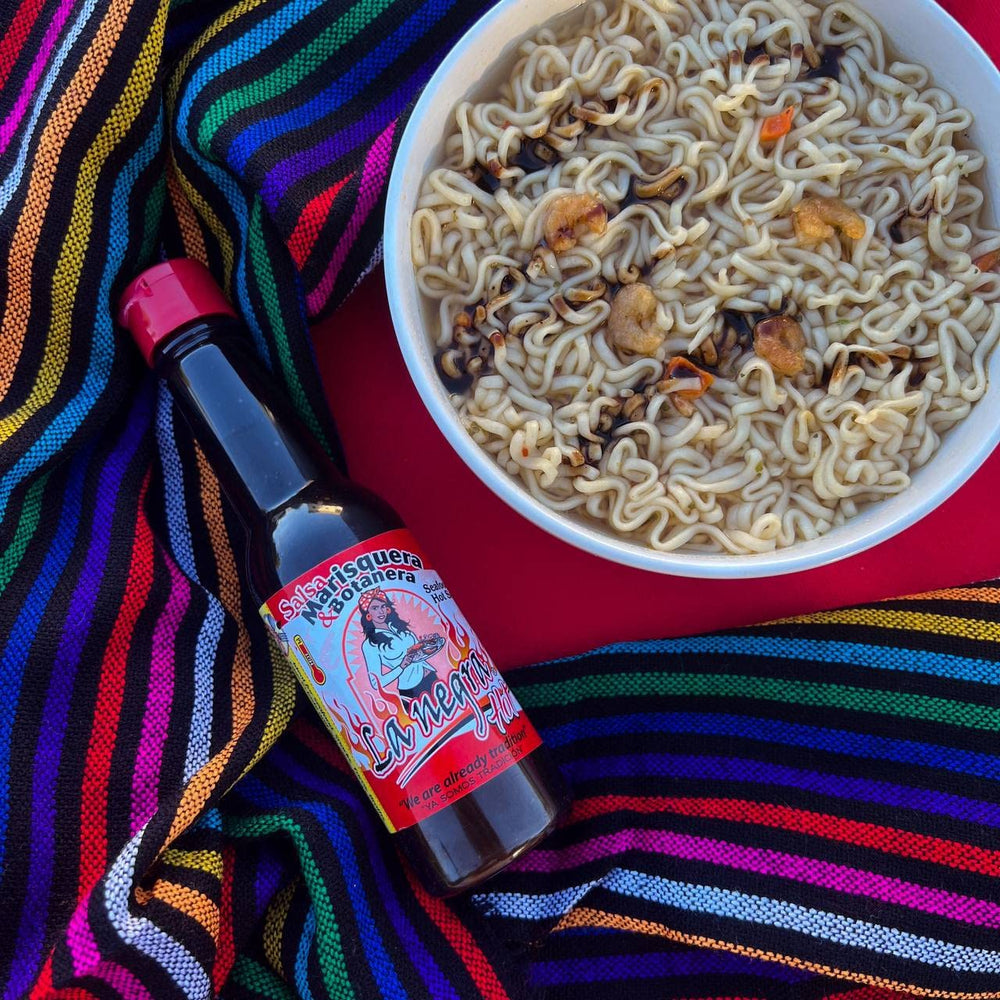 La Negra Va hot salsa marisquera botanera offers spicy versatility for meals.